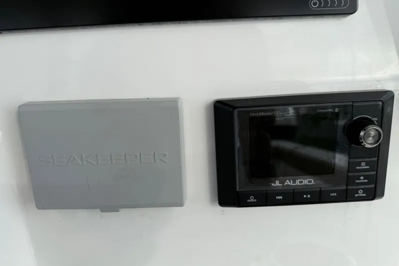 Caymas 341 Center Console Yacht Photos Pics Control panel of 2020 Caymas 341 CC with Seakeeper and JL Audio systems.