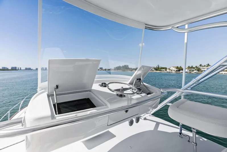 Rebel Yacht Photos Pics Rybovich Sportfish 2000 yacht helm with ocean view, featuring sleek design and modern controls.