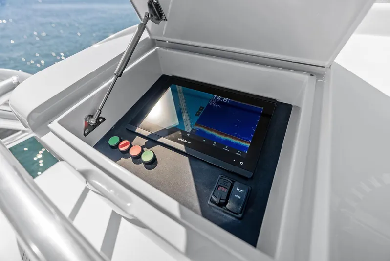 Rebel Yacht Photos Pics Control panel on a 2000 Rybovich Sportfish boat with touchscreen and buttons.