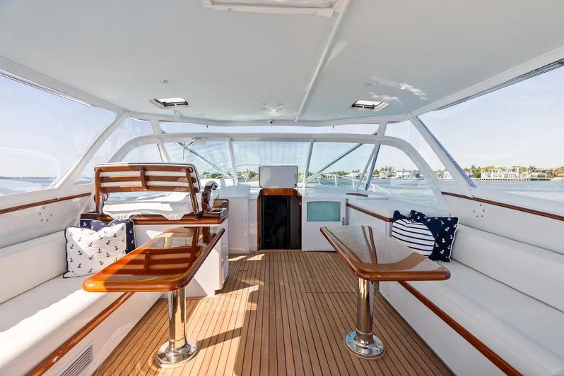 Rebel Yacht Photos Pics Luxurious 2000 Rybovich Sportfish yacht interior with wooden accents and plush seating.