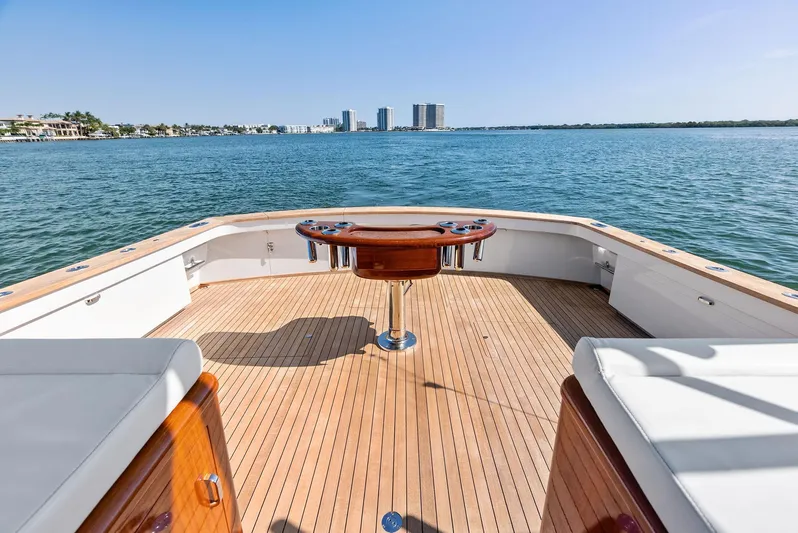 Rebel Yacht Photos Pics Rybovich Sportfish 2000 yacht deck with ocean view, featuring wooden flooring and seating.
