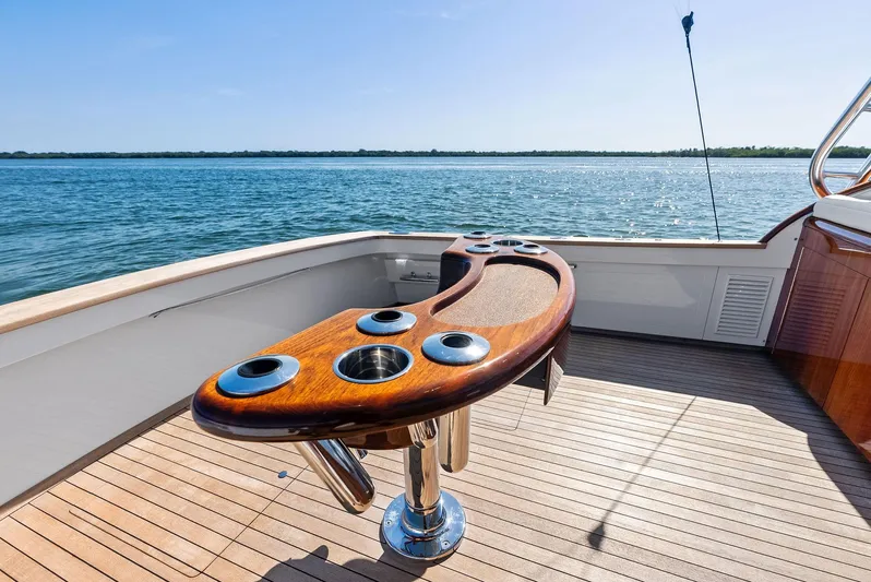 Rebel Yacht Photos Pics Rybovich Sportfish 2000 yacht deck with wooden fighting chair overlooking the ocean.
