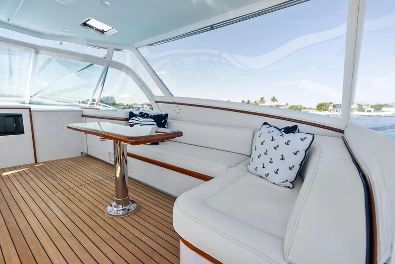 Rebel Yacht Photos Pics Luxurious interior of a 2000 Rybovich Sportfish yacht with elegant seating and nautical decor.