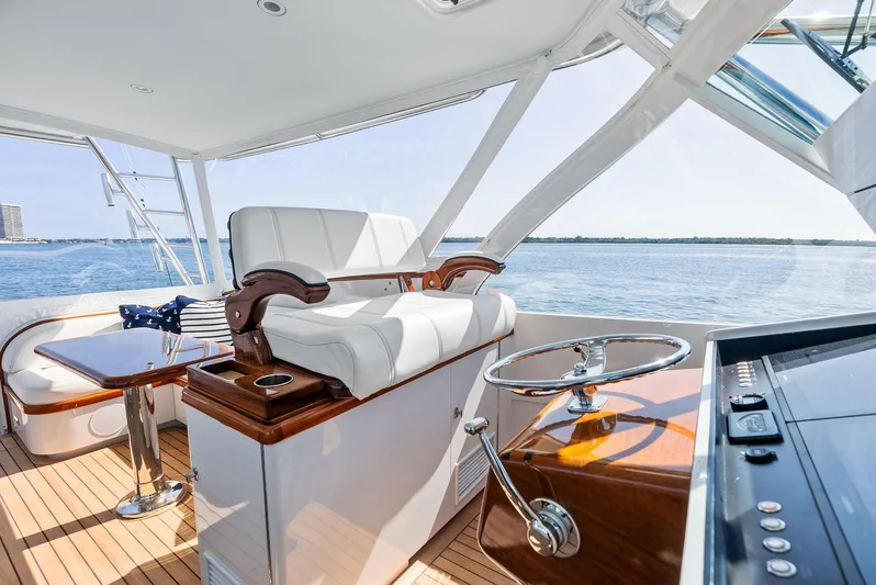 Rebel Yacht Photos Pics Luxurious 2000 Rybovich Sportfish yacht interior with elegant seating and steering wheel.