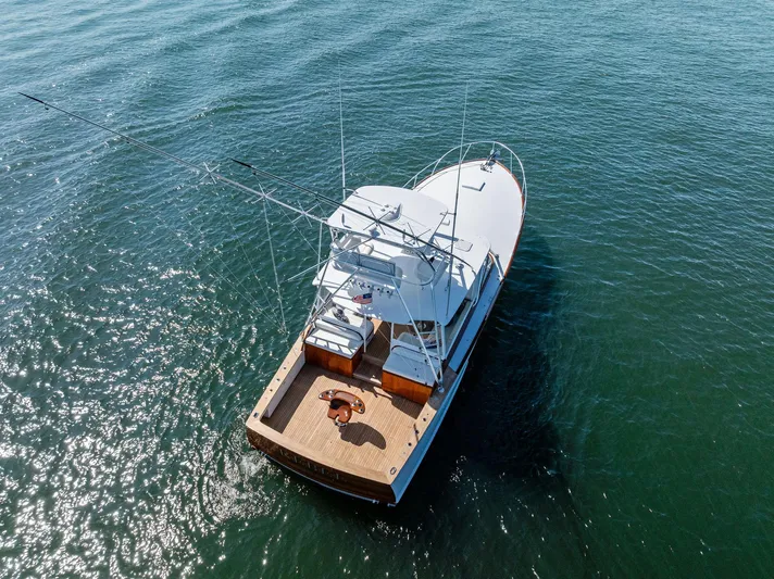 Rebel Yacht Photos Pics Rybovich Sportfish 2000 boat on open water, aerial view.