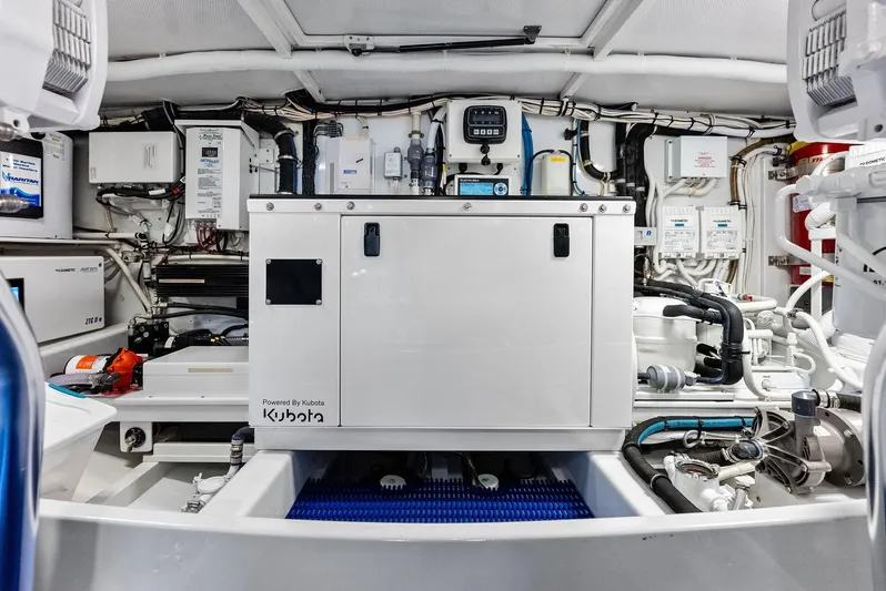 Rebel Yacht Photos Pics Engine room of a 2000 Rybovich Express with Kubota generator.