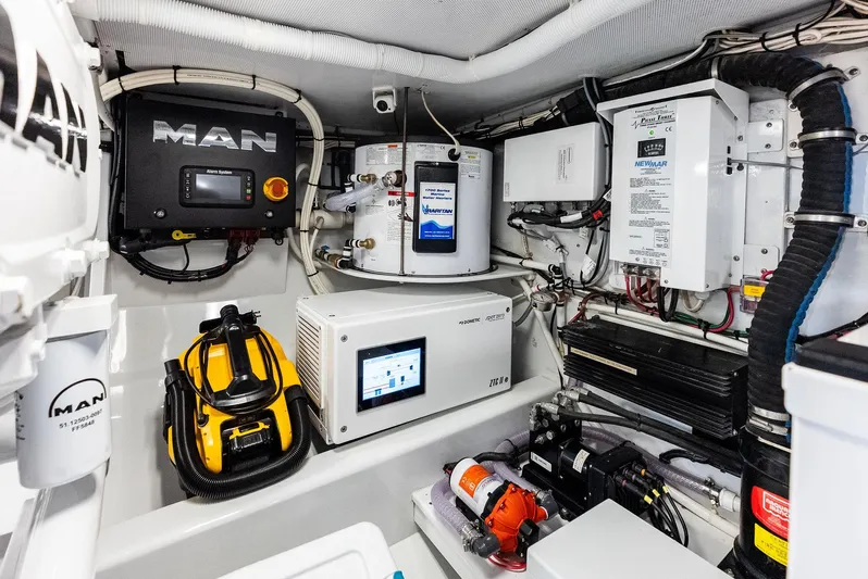 Rebel Yacht Photos Pics Engine room of a 2000 Rybovich Express with modern equipment.