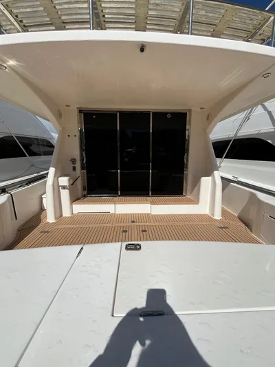 Team Yacht Photos Pics 2007 Maritimo M60 yacht deck with sliding glass doors and spacious seating area.