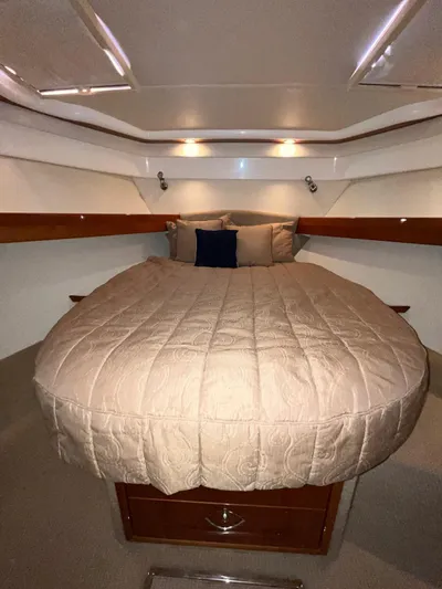 Team Yacht Photos Pics Luxurious cabin interior of 2007 Maritimo M60 yacht with cozy bedding.