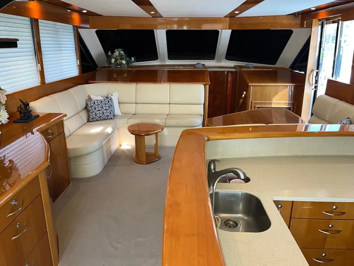 Team Yacht Photos Pics Luxurious interior of a 2007 Maritimo M60 yacht with elegant wood finishes.