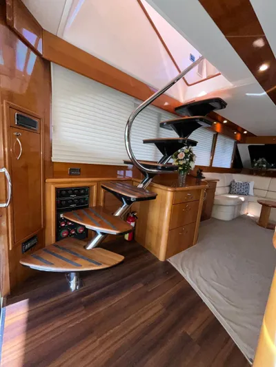 Team Yacht Photos Pics Luxurious interior of a 2007 Maritimo M60 yacht with elegant spiral staircase.