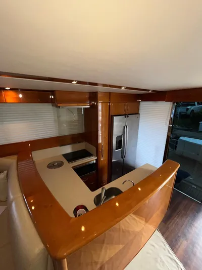Team Yacht Photos Pics Luxurious interior of 2007 Maritimo M60 yacht with modern kitchen and sleek design.