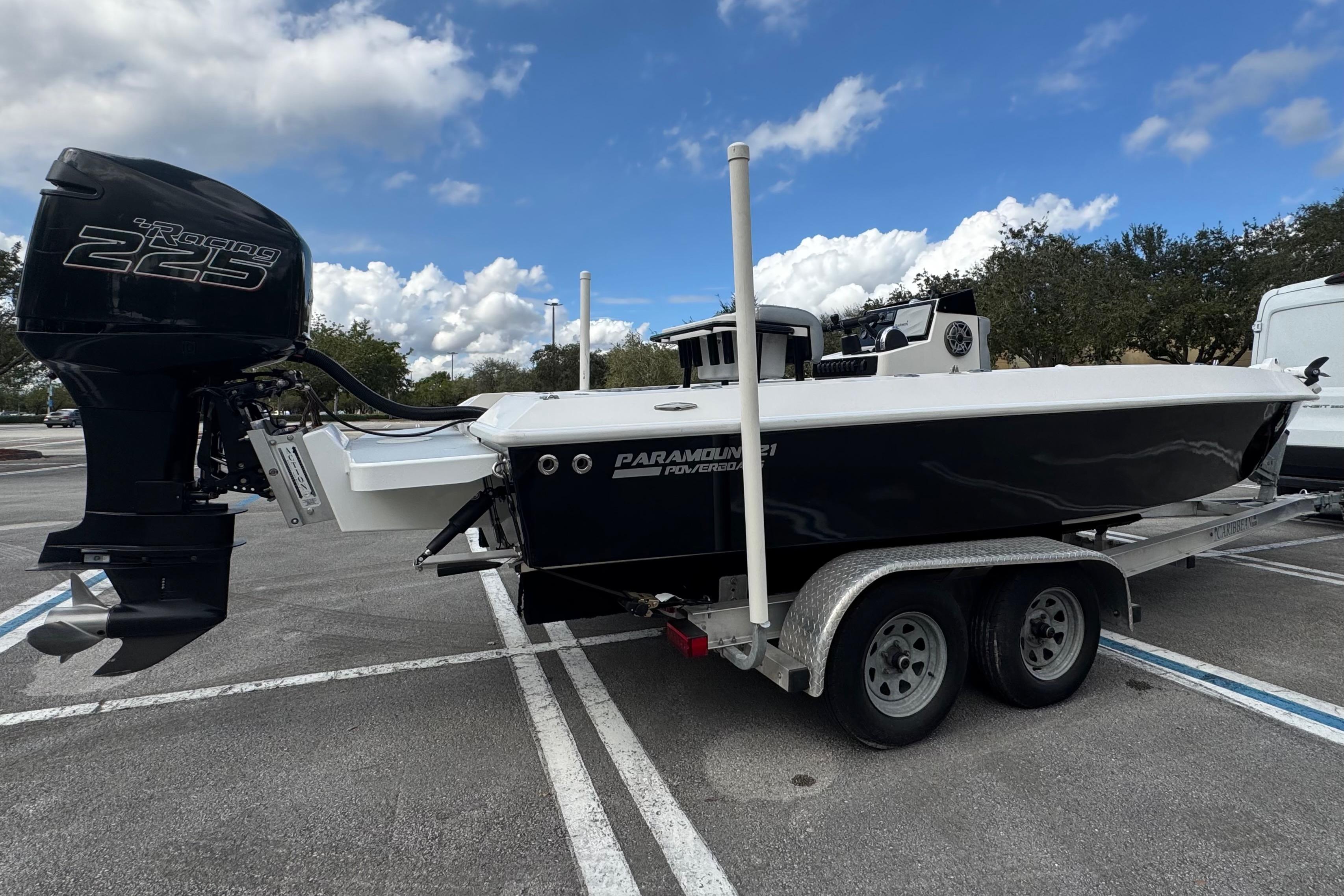 2010 Paramount Sportfisherman 21' boat on trailer with powerful outboard motor.