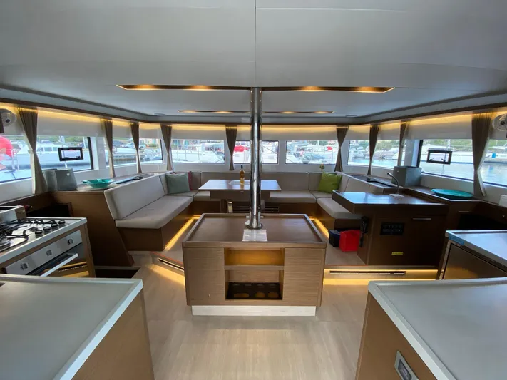 Out Of The Blue Yacht Photos Pics Luxurious interior of 2019 Lagoon 50 catamaran with modern kitchen and seating area.