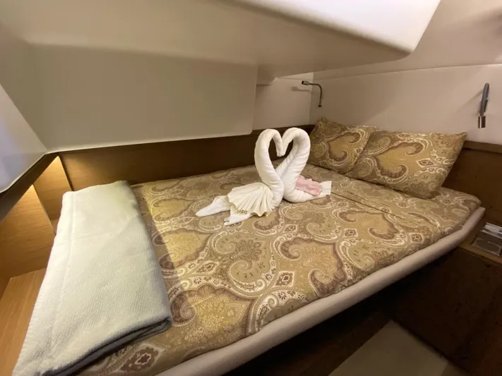 Out Of The Blue Yacht Photos Pics Luxurious cabin interior of 2019 Lagoon 50 yacht with elegant bedding and towel swans.
