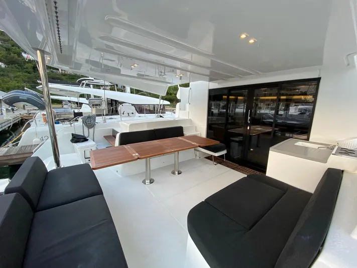 Out Of The Blue Yacht Photos Pics Spacious 2019 Lagoon 50 yacht deck with seating and dining area.