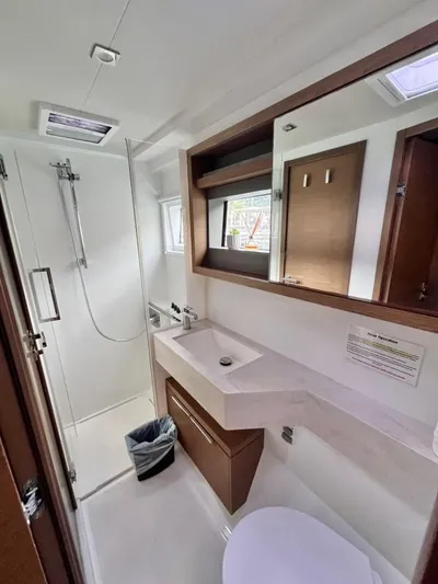 Out Of The Blue Yacht Photos Pics Modern bathroom in 2019 Lagoon 50 yacht with shower, sink, and toilet.