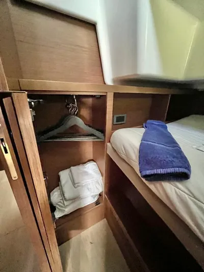 Out Of The Blue Yacht Photos Pics Interior cabin of 2019 Lagoon 50 yacht with bed and closet space.