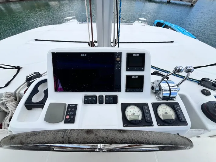 Out Of The Blue Yacht Photos Pics Helm station of 2019 Lagoon 50 catamaran with navigation instruments and controls.
