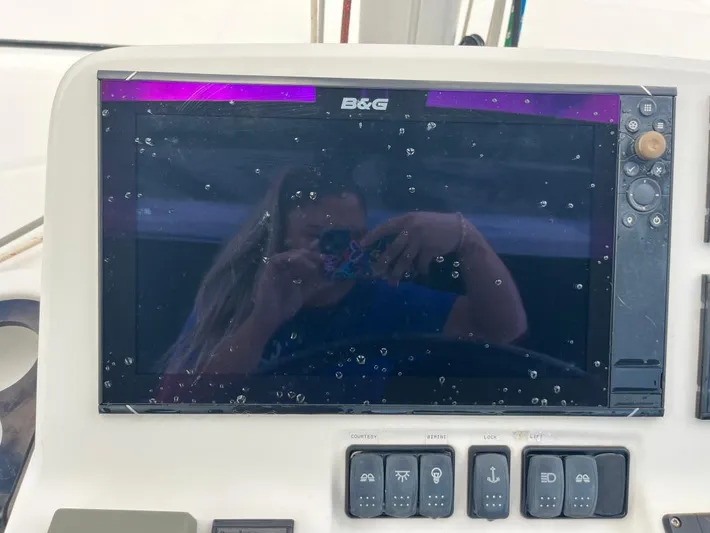 Out Of The Blue Yacht Photos Pics B&G navigation display on 2019 Lagoon 50 yacht, with water droplets and reflection.