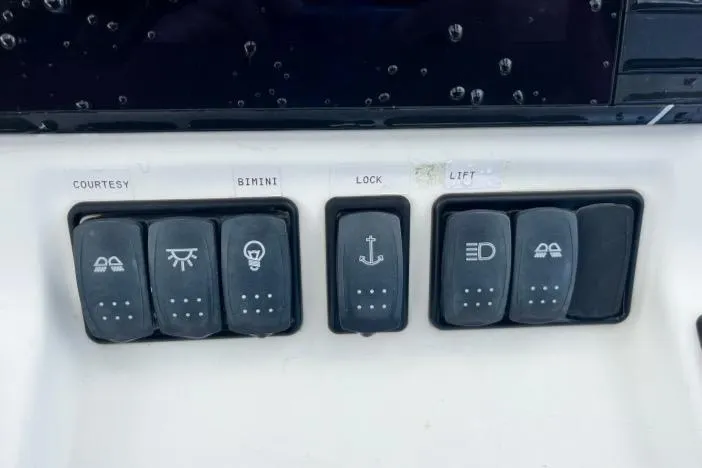 Out Of The Blue Yacht Photos Pics Control panel of a 2019 Lagoon 50 yacht with labeled switches.