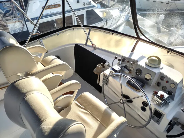L' Espirit Yacht Photos Pics Cockpit of 1989 Ocean Alexander 440 CPMY yacht with dual helm seats and navigation controls.