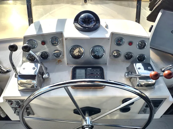 L' Espirit Yacht Photos Pics 1989 Ocean Alexander 440 CPMY helm with gauges, controls, and steering wheel.