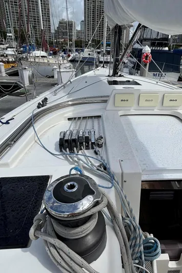 Vamoosh Yacht Photos Pics 2012 X-Yachts XP-44 sailboat deck with winch and rigging in marina setting.