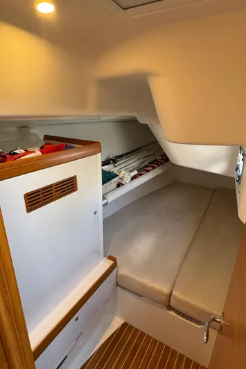 Vamoosh Yacht Photos Pics Cozy cabin interior of 2012 X-Yachts XP-44 with cushioned seating and wooden accents.