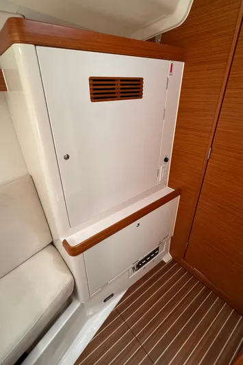 Vamoosh Yacht Photos Pics Interior of 2012 X-Yachts XP-44, featuring wooden cabinetry and striped flooring.