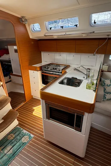 Vamoosh Yacht Photos Pics Interior of 2012 X-Yachts XP-44 sailboat featuring a modern kitchen with wood accents.