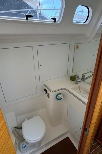Vamoosh Yacht Photos Pics Interior of 2012 X-Yachts XP-44 yacht bathroom with toilet and sink.