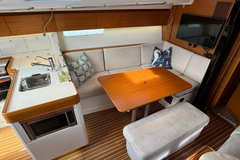 Vamoosh Yacht Photos Pics Interior of 2012 X-Yachts XP-44 featuring a cozy dining area and modern kitchen.