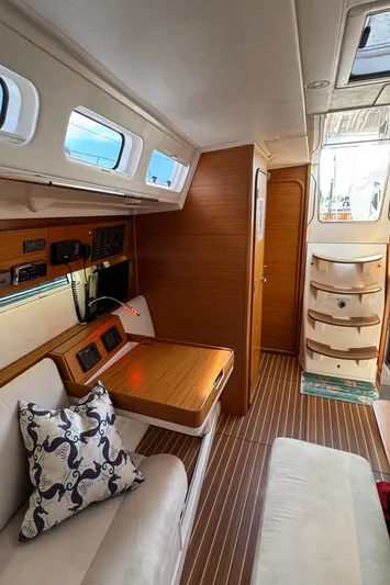 Vamoosh Yacht Photos Pics Interior of 2012 X-Yachts XP-44, featuring elegant wood finish and comfortable seating.