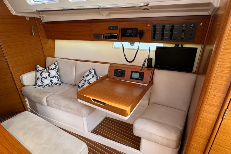 Vamoosh Yacht Photos Pics Interior of 2012 X-Yachts XP-44 sailboat with cozy seating and navigation equipment.