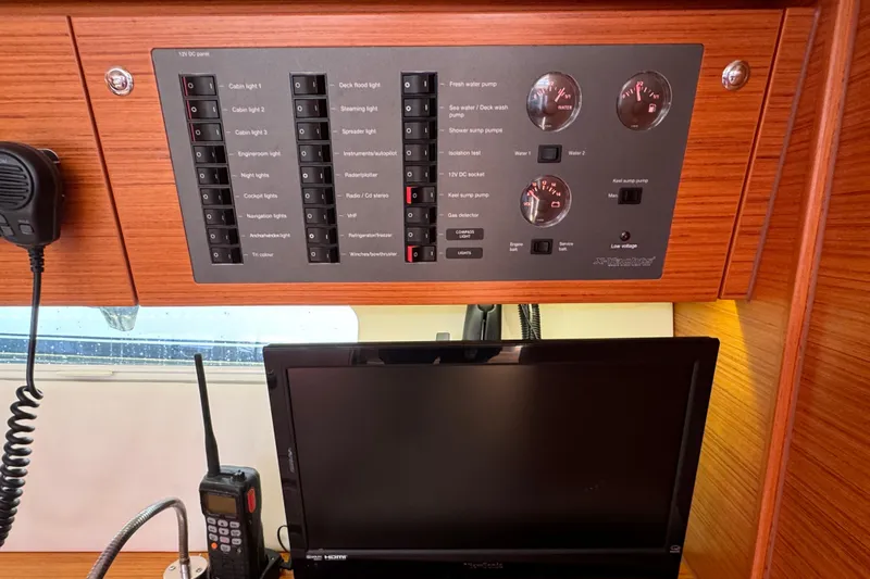 Vamoosh Yacht Photos Pics Control panel and electronics inside a 2012 X-Yachts XP-44 sailboat cabin.