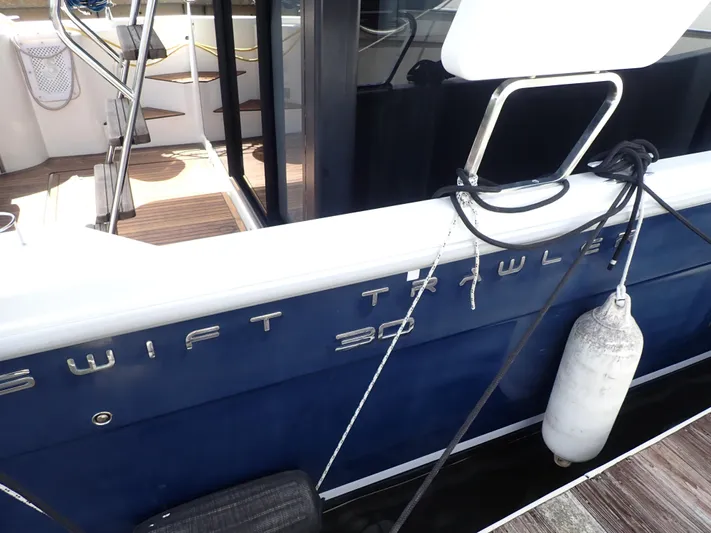 Blue Bird Yacht Photos Pics 2017 Beneteau Swift Trawler 30, docked with visible fender and deck details.