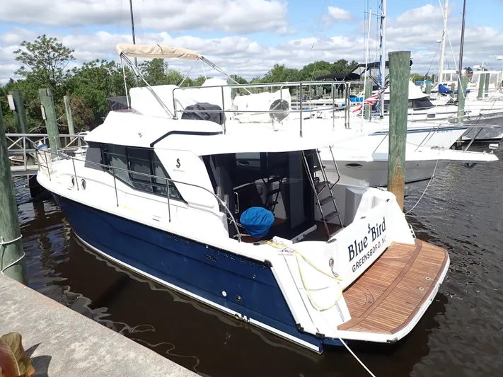 Blue Bird Yacht Photos Pics 2017 Beneteau Swift Trawler 30 docked, featuring a sleek design and spacious deck.