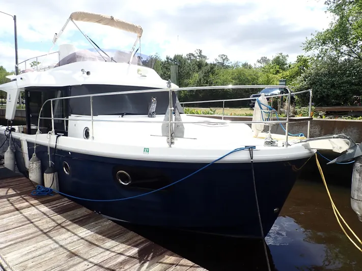 Blue Bird Yacht Photos Pics 2017 Beneteau Swift Trawler 30 docked, featuring sleek design and spacious deck.