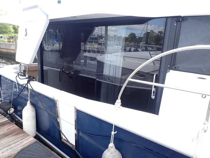 Blue Bird Yacht Photos Pics 2017 Beneteau Swift Trawler 30 docked, showcasing sleek design and modern features.