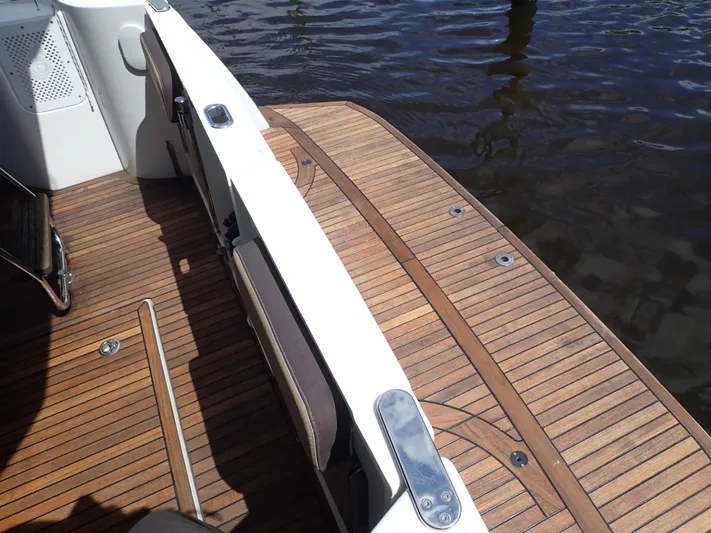 Blue Bird Yacht Photos Pics 2017 Beneteau Swift Trawler 30, teak deck detail by the water.
