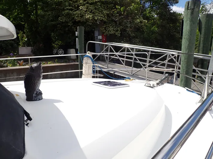 Blue Bird Yacht Photos Pics 2017 Beneteau Swift Trawler 30 docked, featuring deck details and railing.