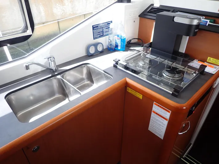 Blue Bird Yacht Photos Pics 2017 Beneteau Swift Trawler 30 kitchen with dual sink and stove.