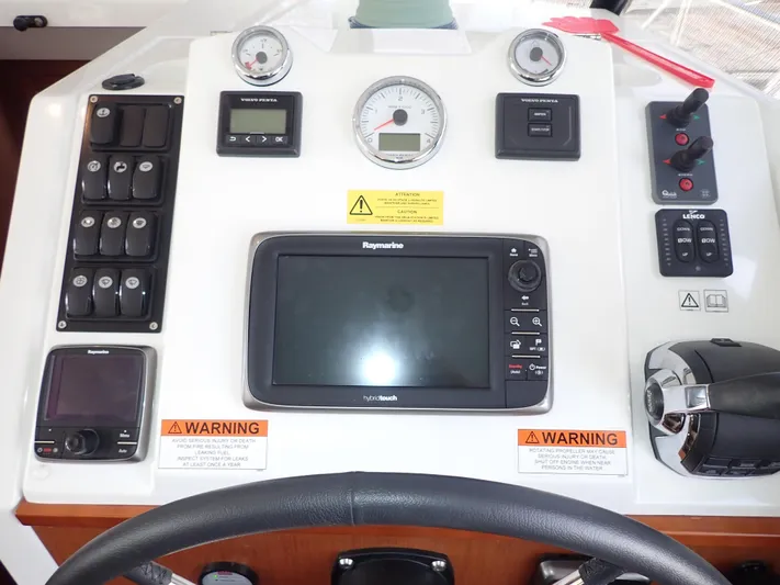 Blue Bird Yacht Photos Pics Control panel of 2017 Beneteau Swift Trawler 30 with navigation and monitoring instruments.