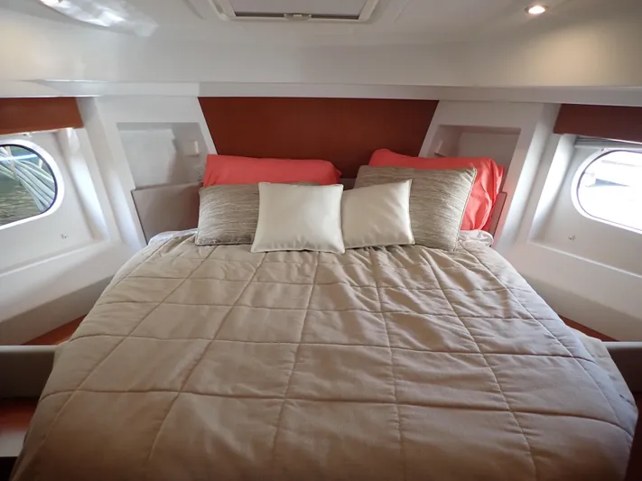 Blue Bird Yacht Photos Pics 2017 Beneteau Swift Trawler 30 cabin with cozy bed and porthole windows.