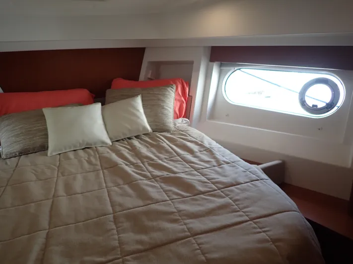 Blue Bird Yacht Photos Pics 2017 Beneteau Swift Trawler 30 cabin with cozy bed and porthole window.