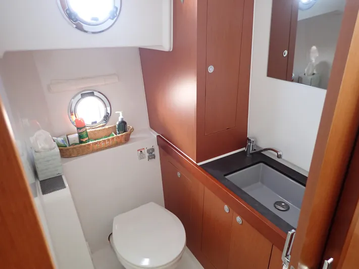 Blue Bird Yacht Photos Pics Bathroom interior of 2017 Beneteau Swift Trawler 30 with sink and toilet.