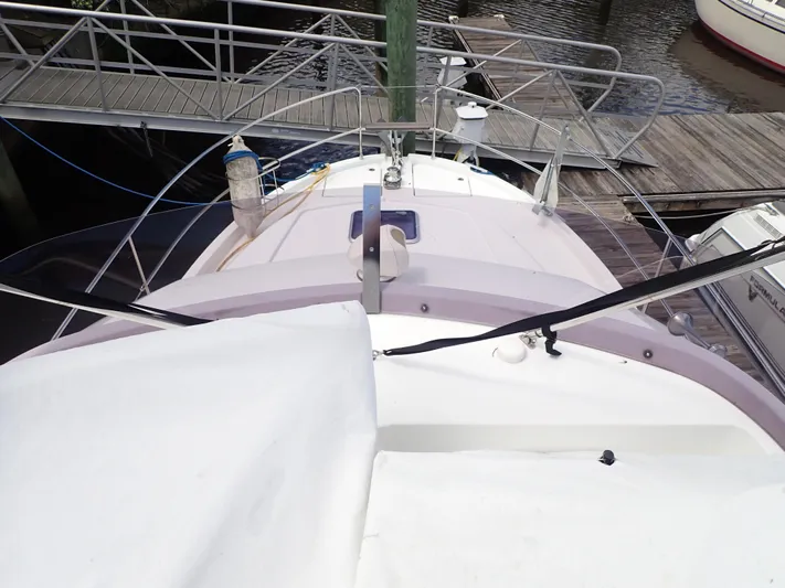 Blue Bird Yacht Photos Pics 2017 Beneteau Swift Trawler 30 docked, view from above showing deck and railings.
