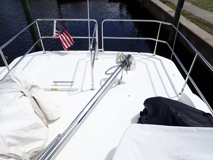 Blue Bird Yacht Photos Pics 2017 Beneteau Swift Trawler 30 deck with American flag and railing.