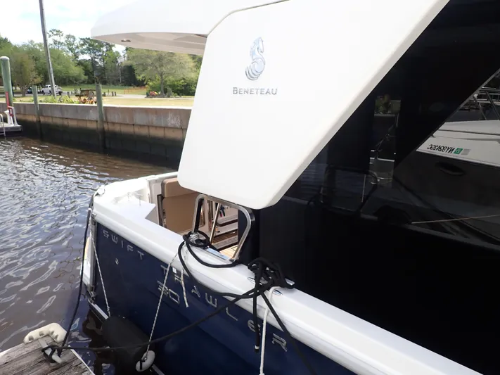 Blue Bird Yacht Photos Pics 2017 Beneteau Swift Trawler 30 docked, showcasing sleek design and branding.